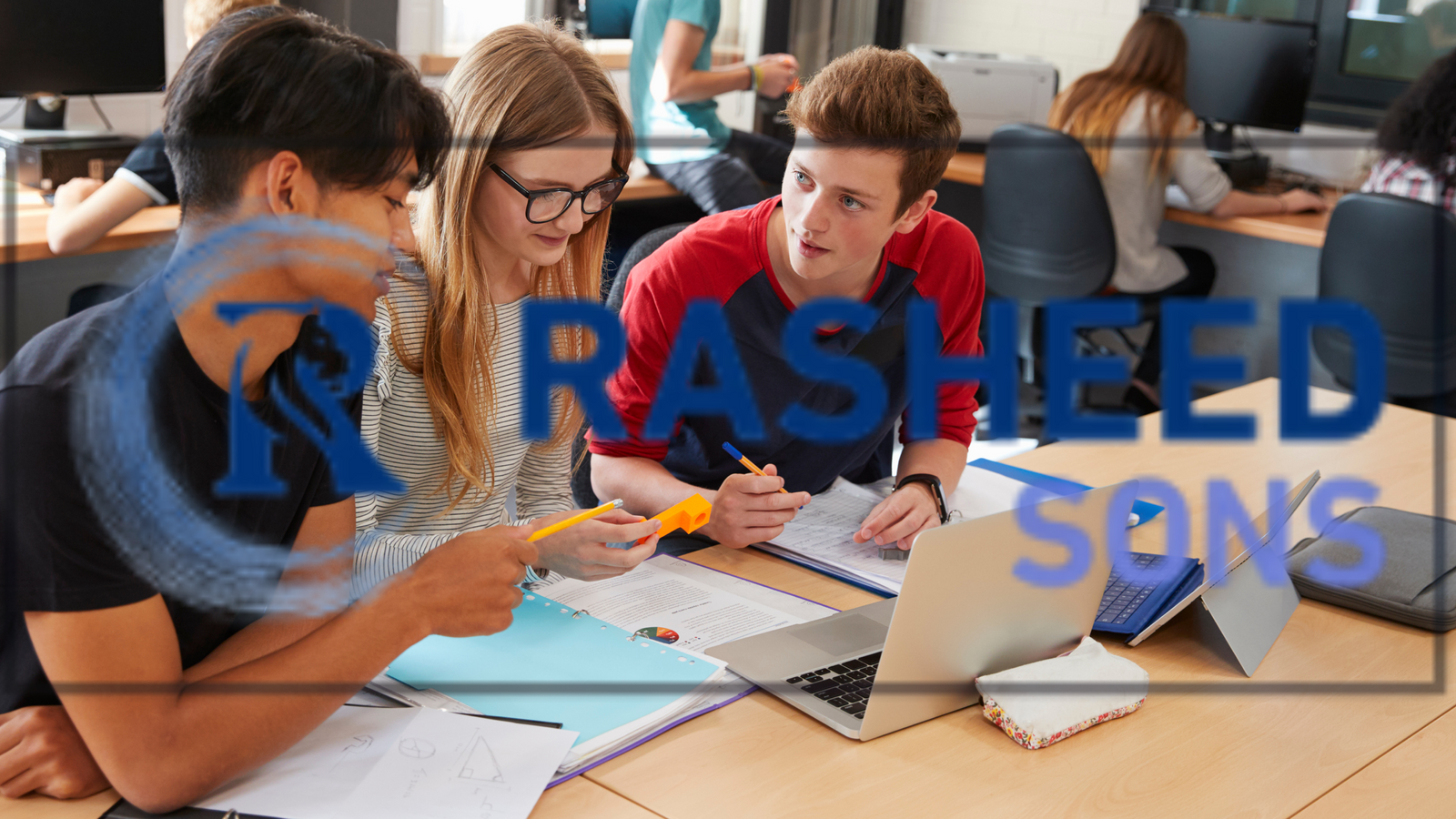 Students collaborating and working on a laptop, highlighting the availability of cheap laptops for students in South Africa.