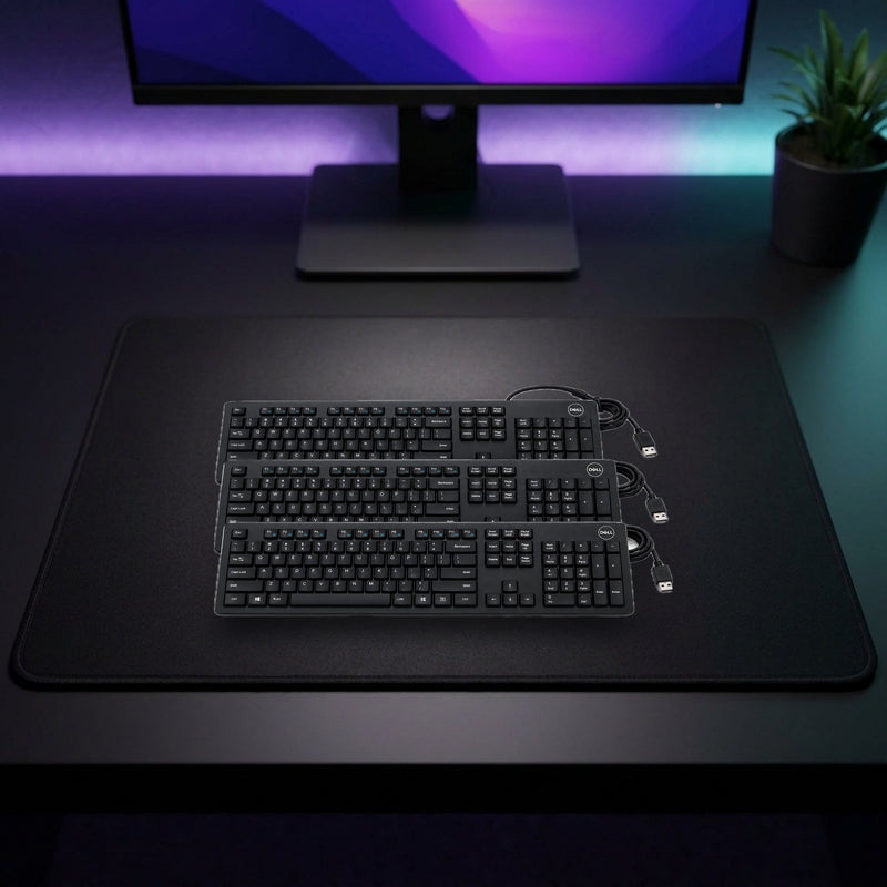 Lifestyle: Dell KB216 Refurbished Wired USB Keyboard – Pack of 3 shown on a styled desk (actual product photo, room is illustrative)