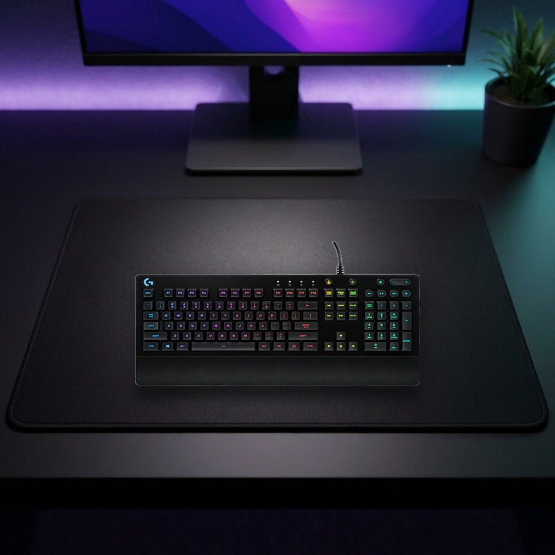 Lifestyle: Logitech G213 Prodigy RGB Wired Gaming Keyboard – English QWERTY shown on a styled desk (actual product photo, room is illustrative)