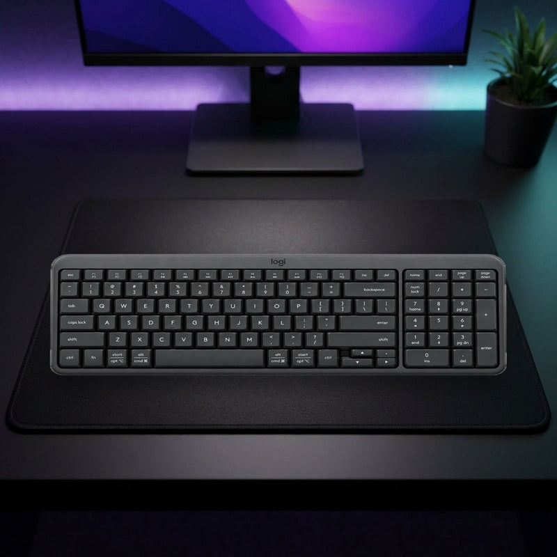 Lifestyle: Logitech K250 Compact Bluetooth Wireless Keyboard with Numeric Keypad shown on a styled desk (actual product photo, room is illustrative)