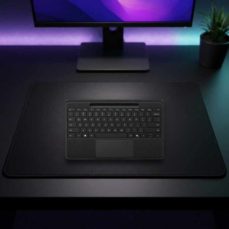 Lifestyle: Microsoft Surface Pro 13-inch Flex Keyboard – Wireless Detachable Keyboard with Haptic Touchpad – No Pen Included shown on a styled desk (actual product photo, room is illustrative)