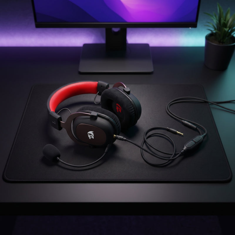 Lifestyle: Redragon H510 Zeus 2 Wired Gaming Headset | Virtual 7.1 Surround | 53mm Drivers | Detachable Mic | USB + 3.5mm | Black on a desk (illustrative image; the first photo shows the actual product)