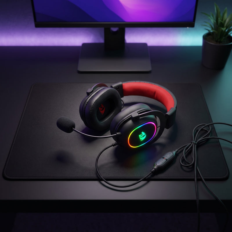 Lifestyle: Redragon H510 Zeus-X RGB USB Gaming Headset | 7.1 Surround | 50mm Drivers | Noise-Reducing Mic | Black on a desk (illustrative image; the first photo shows the actual product)