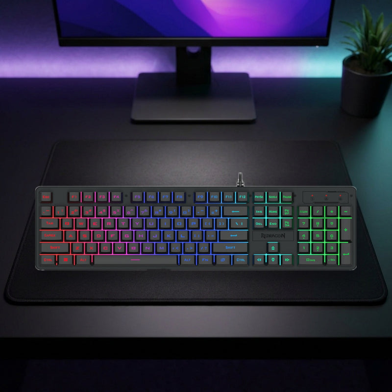 Lifestyle: Redragon K521 Netherbane RGB Membrane Gaming Keyboard | Full-Size 104 Keys | 19-Key Anti-Ghosting | USB-C | Black shown on a styled desk (actual product photo, room is illustrative)