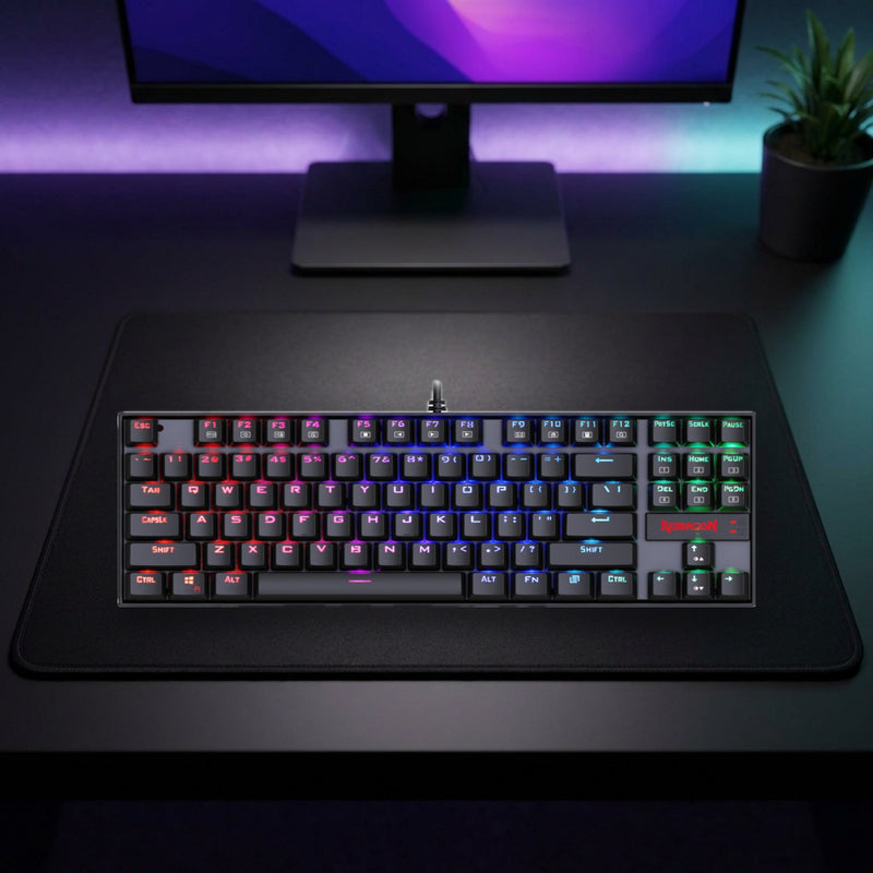 Lifestyle: Redragon K552 Kumara RGB Mechanical Gaming Keyboard | TKL 87 Keys | Red Switches | Metal Build | Black shown on a styled desk (actual product photo, room is illustrative)