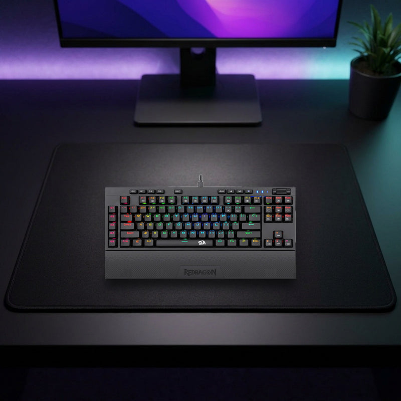 Lifestyle: Redragon K588 Broadsword RGB TKL Mechanical Gaming Keyboard | Red Switches | 18 Lighting Modes | Black shown on a styled desk (actual product photo, room is illustrative)