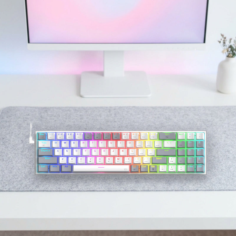 Lifestyle: Redragon K628 Pollux RGB Mechanical Gaming Keyboard | Compact 78 Keys with Numpad | Hot-Swappable Red Switches | White/Grey shown on a styled desk (actual product photo, room is illustrative)