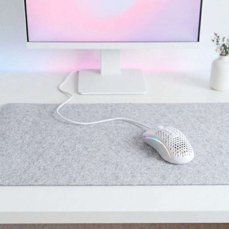 Lifestyle: Redragon M808 Storm RGB Lightweight Wired Gaming Mouse | 12400 DPI, 85g, White on a desk (illustrative image; the first photo shows the actual product)