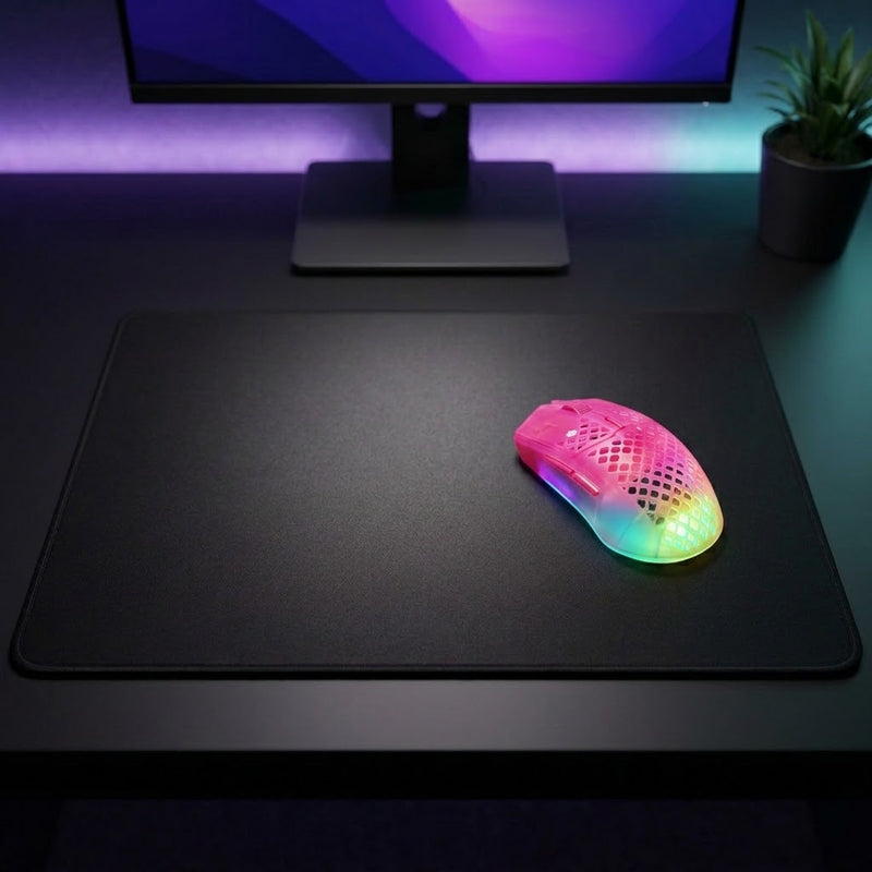 Lifestyle: SteelSeries Aerox 3 Wireless Gen 2 Gaming Mouse - Magenta Haze on a desk (illustrative image; the first photo shows the actual product)